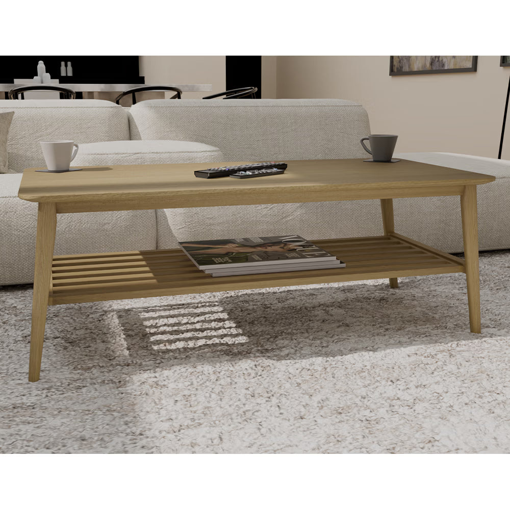 Light wood coffee table with slatted shelf, remote, mugs, and magazines in living room