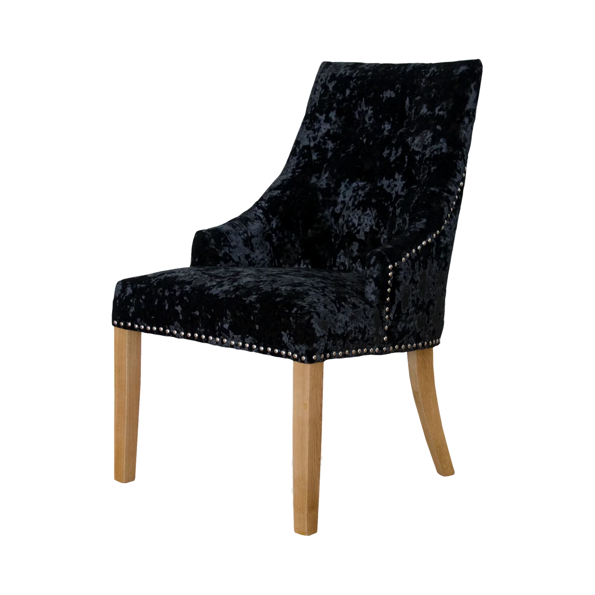 Black velvet dining chair with oak legs and studded trim, angled side view