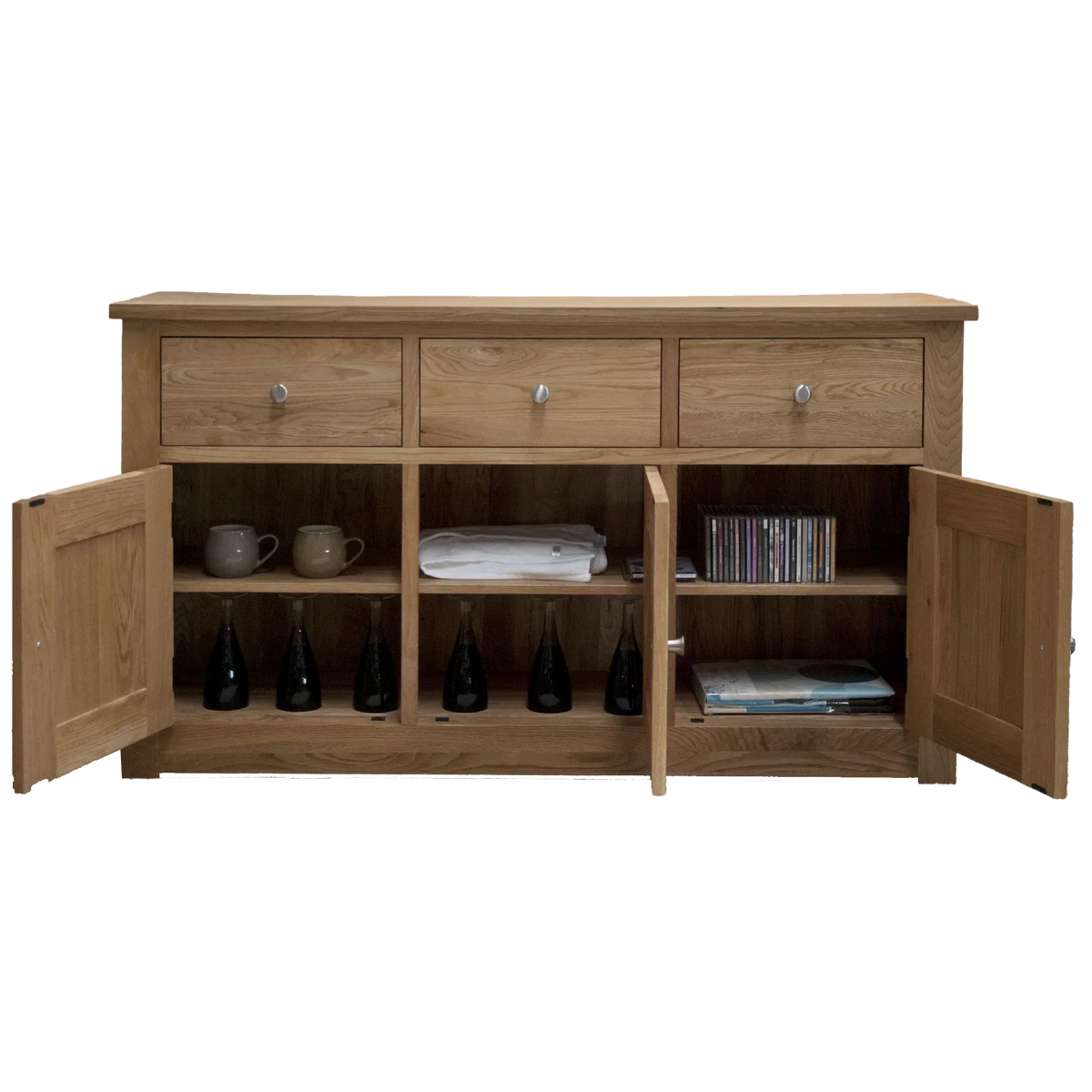 Solid oak sideboard with three drawers and open cupboard shelves displaying mugs and bottles