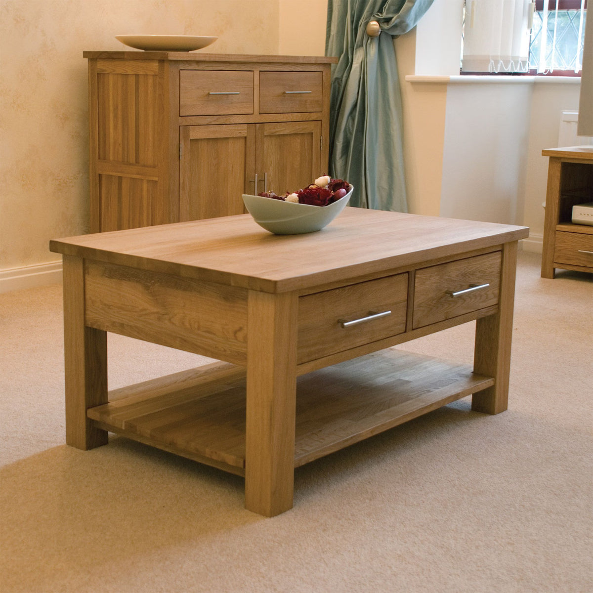 Oak coffee table with drawers and lower shelf in a modern living room setting