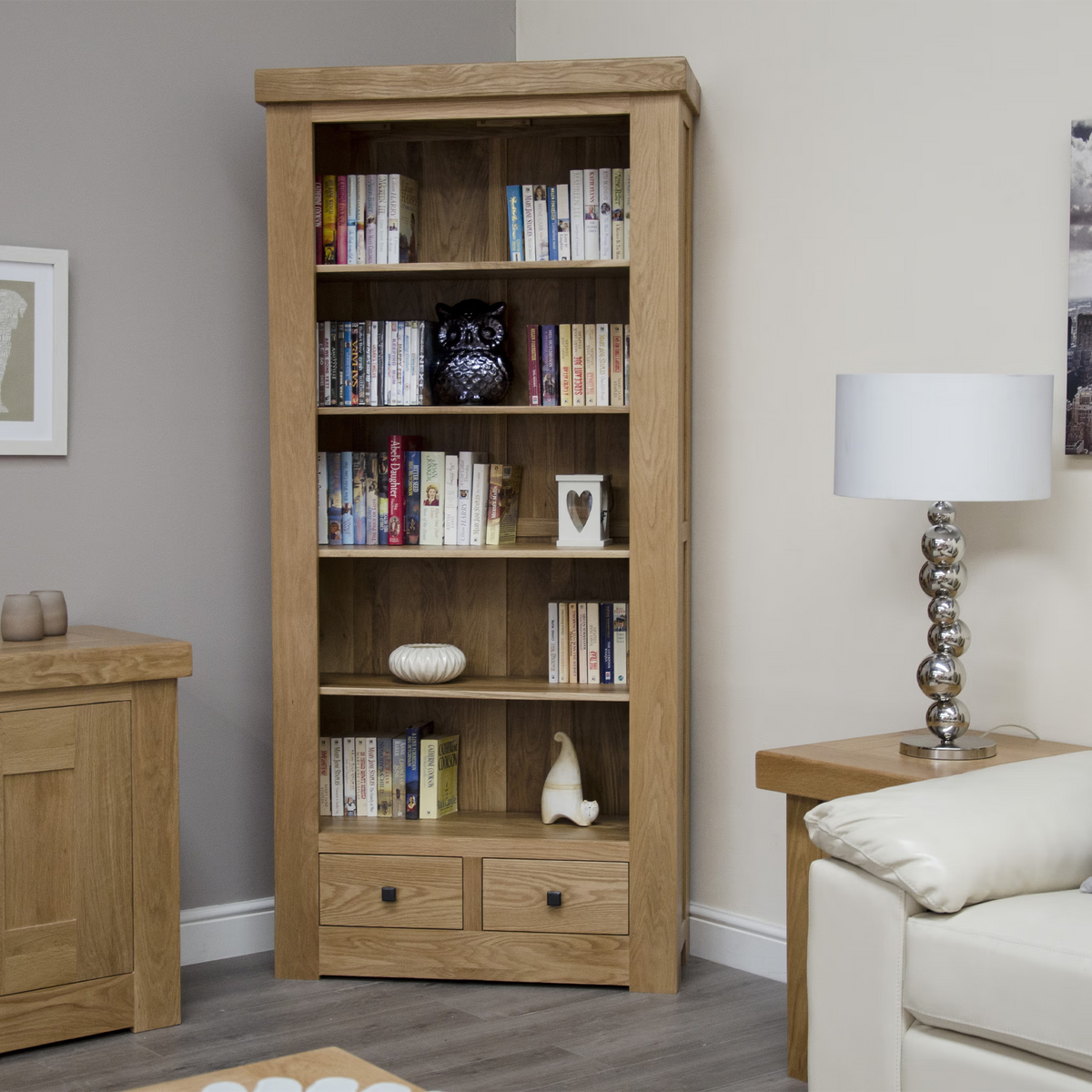 Oak bookcase with shelving and drawers in living room setting