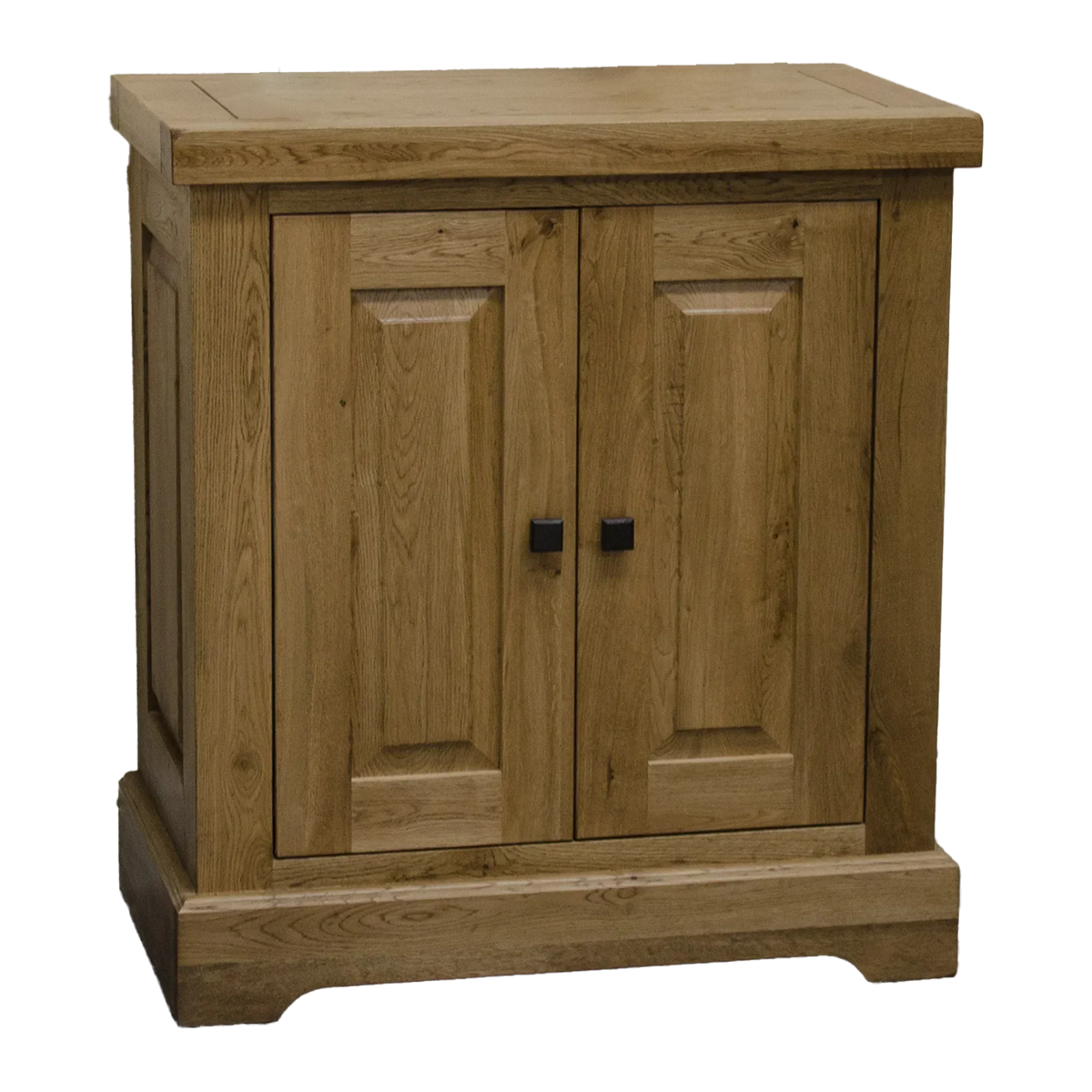 Natural oak cabinet with two paneled doors and black square handles, front view