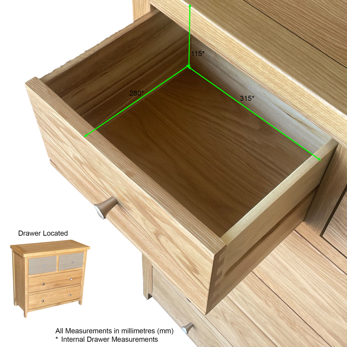 Oak chest of drawers with open drawer showing internal measurements in millimetres