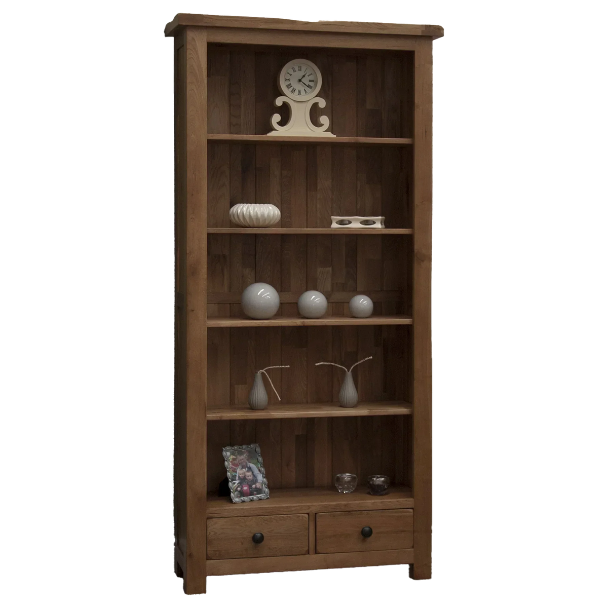 Oak bookcase with shelves, two drawers, and decorative accessories displayed