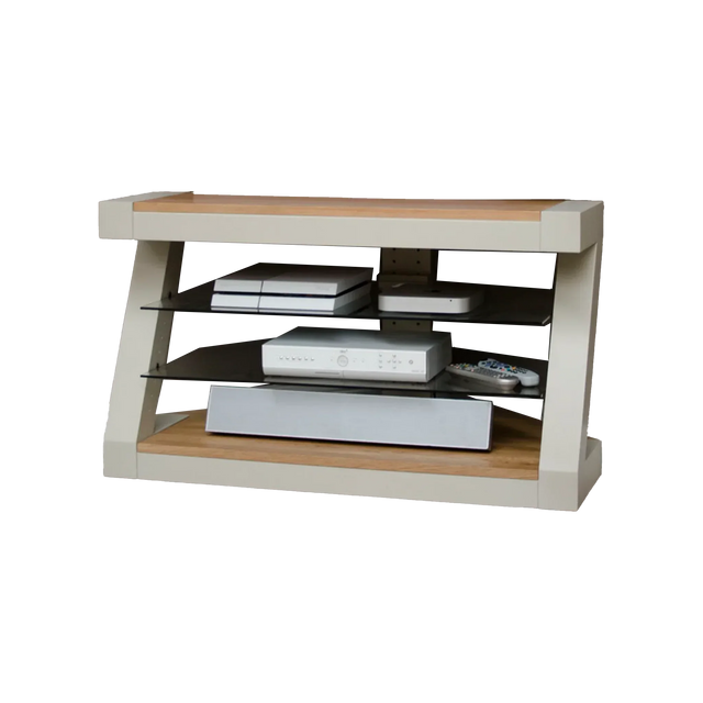 Modern TV stand with glass shelves and oak top, holding media devices and remotes