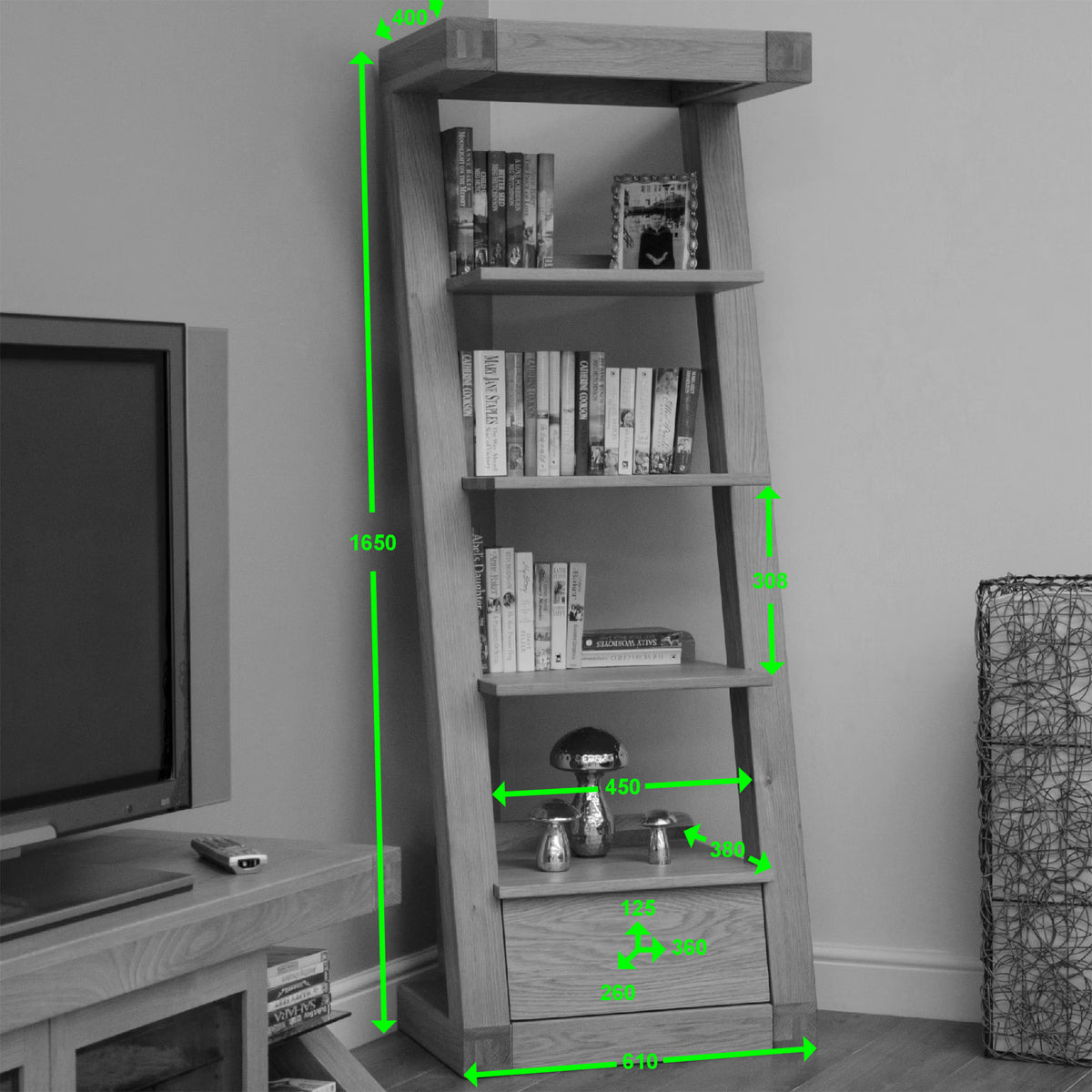 Ladder style wooden bookshelf with books, decor items, and visible measurement markings
