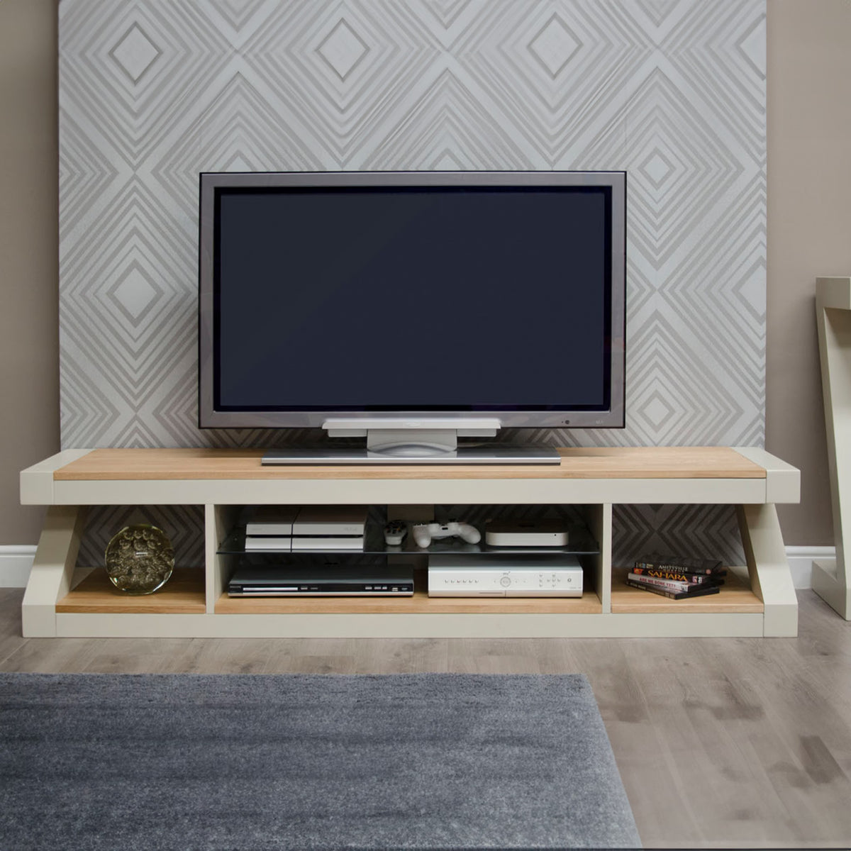 Modern TV unit with open shelving, wood and white finish, holding electronics and decor
