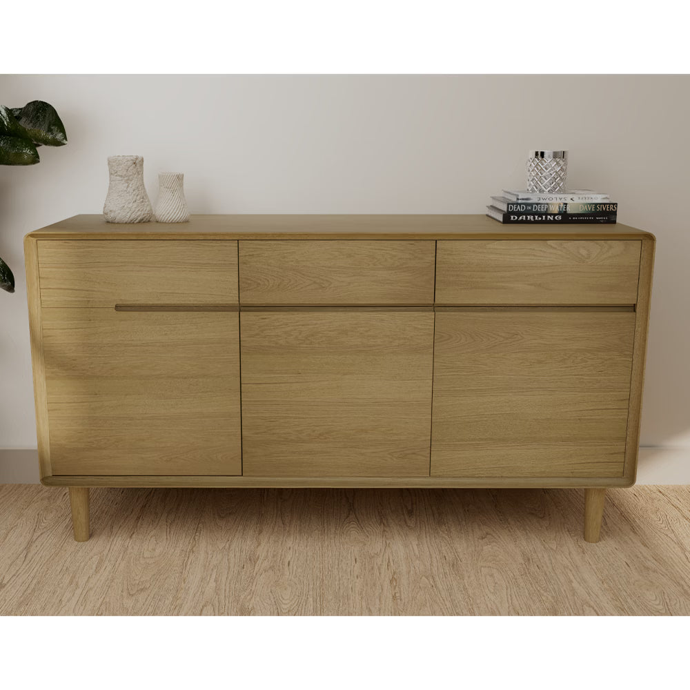Oak sideboard with three drawers, wooden doors and decorative vases in modern living room