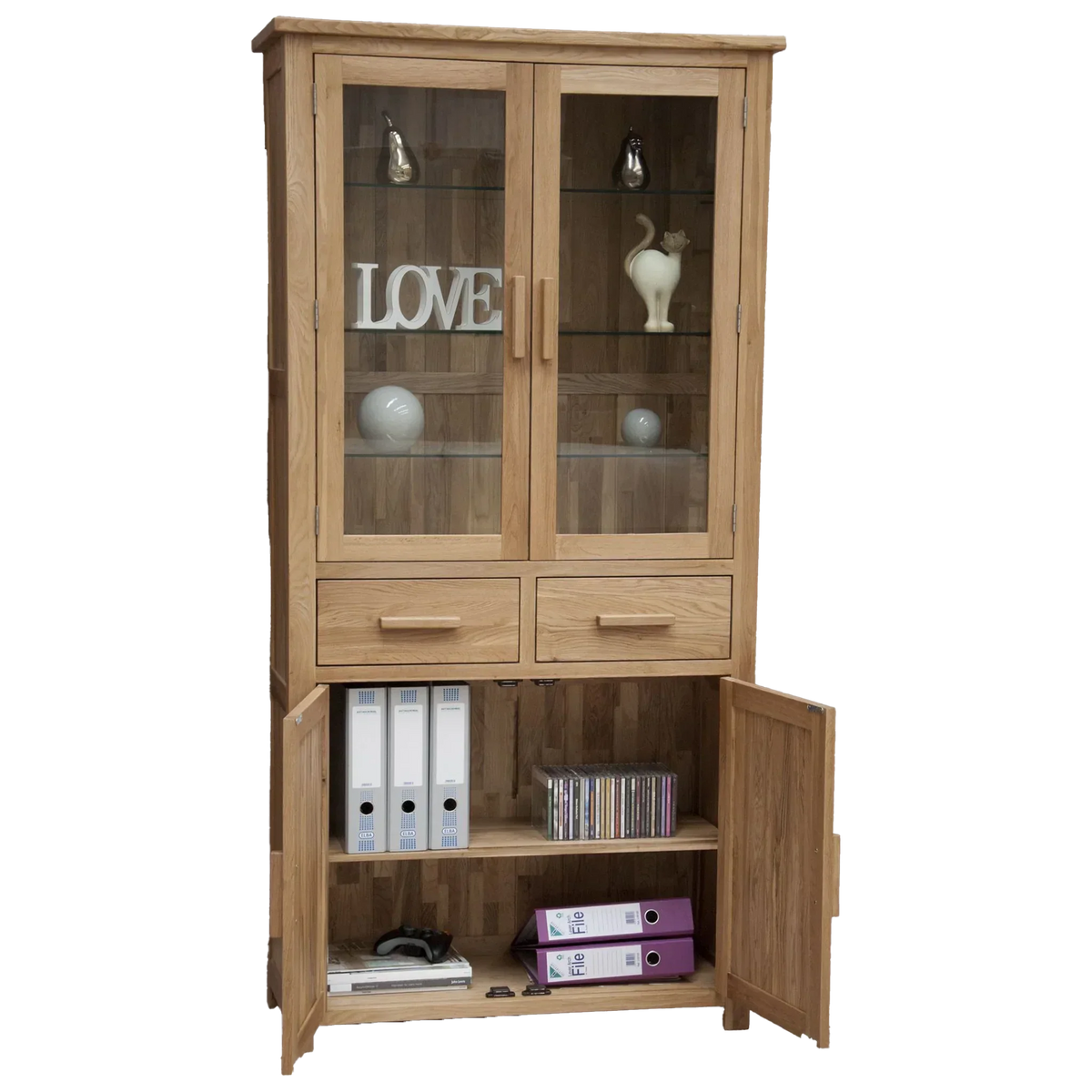 Oak display cabinet with glass doors, drawers, and open lower shelf storing folders and CDs