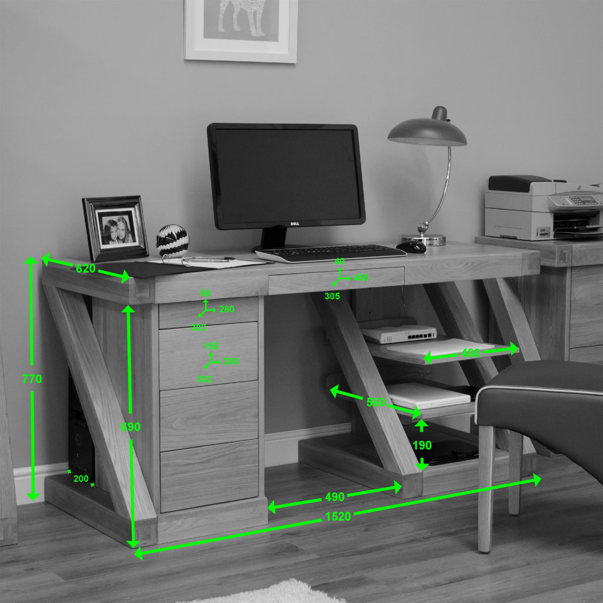 Oak office desk with drawers, shelving and desktop computer, green measurement lines shown