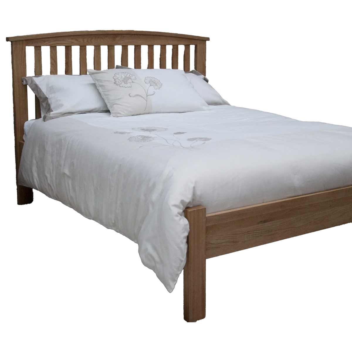 Oak wooden bed frame with slatted headboard and white floral bedding
