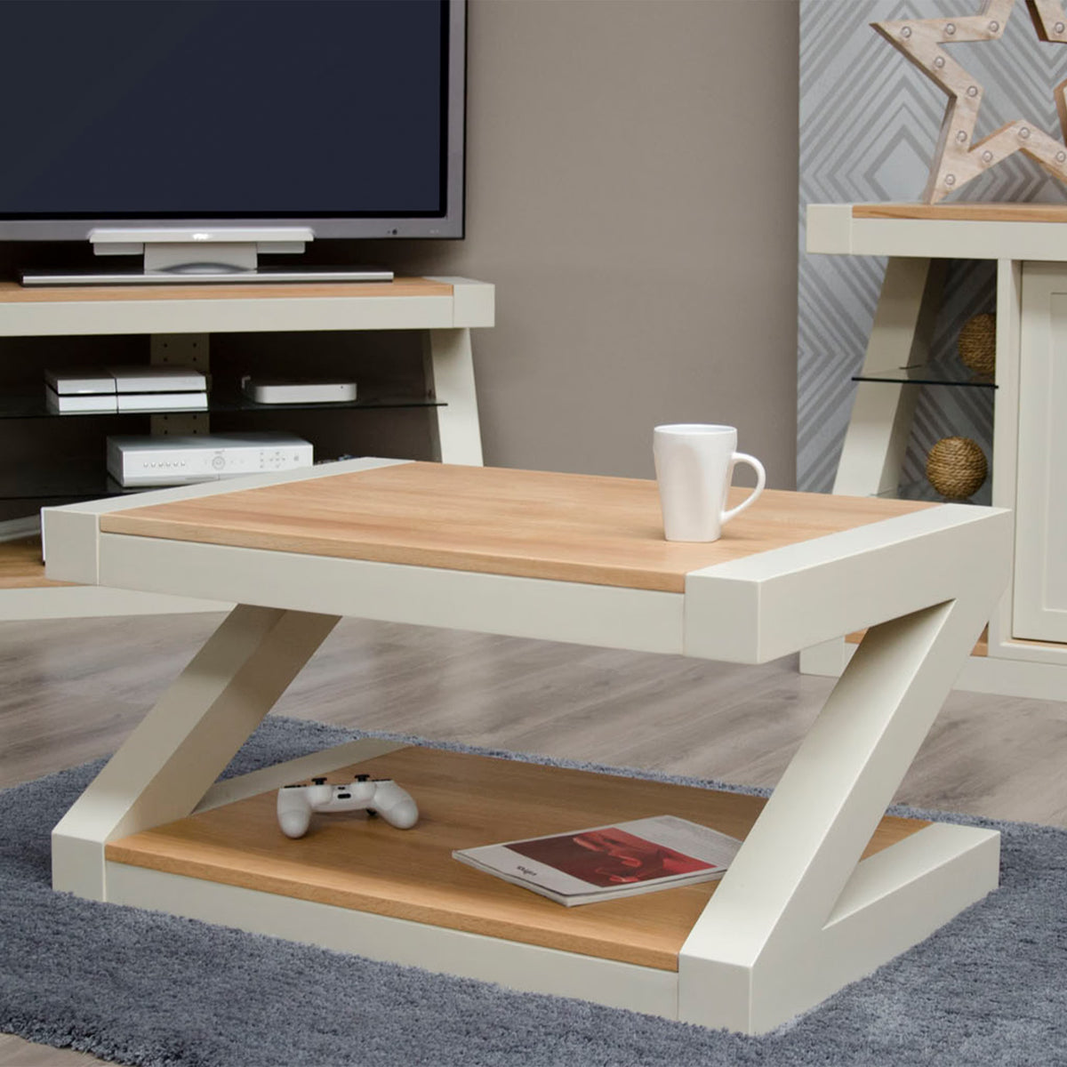 Modern oak and cream coffee table with lower shelf, styled on grey rug in living room