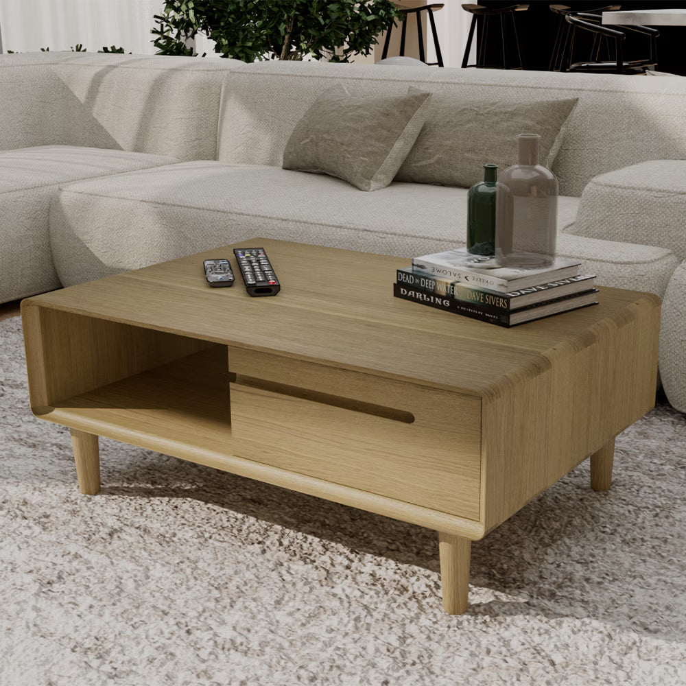 Wood coffee table with open shelf, decorative books, and vases in modern living room