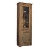 Tall oak display cabinet with glass door and wooden lower cupboard, shown at an angle