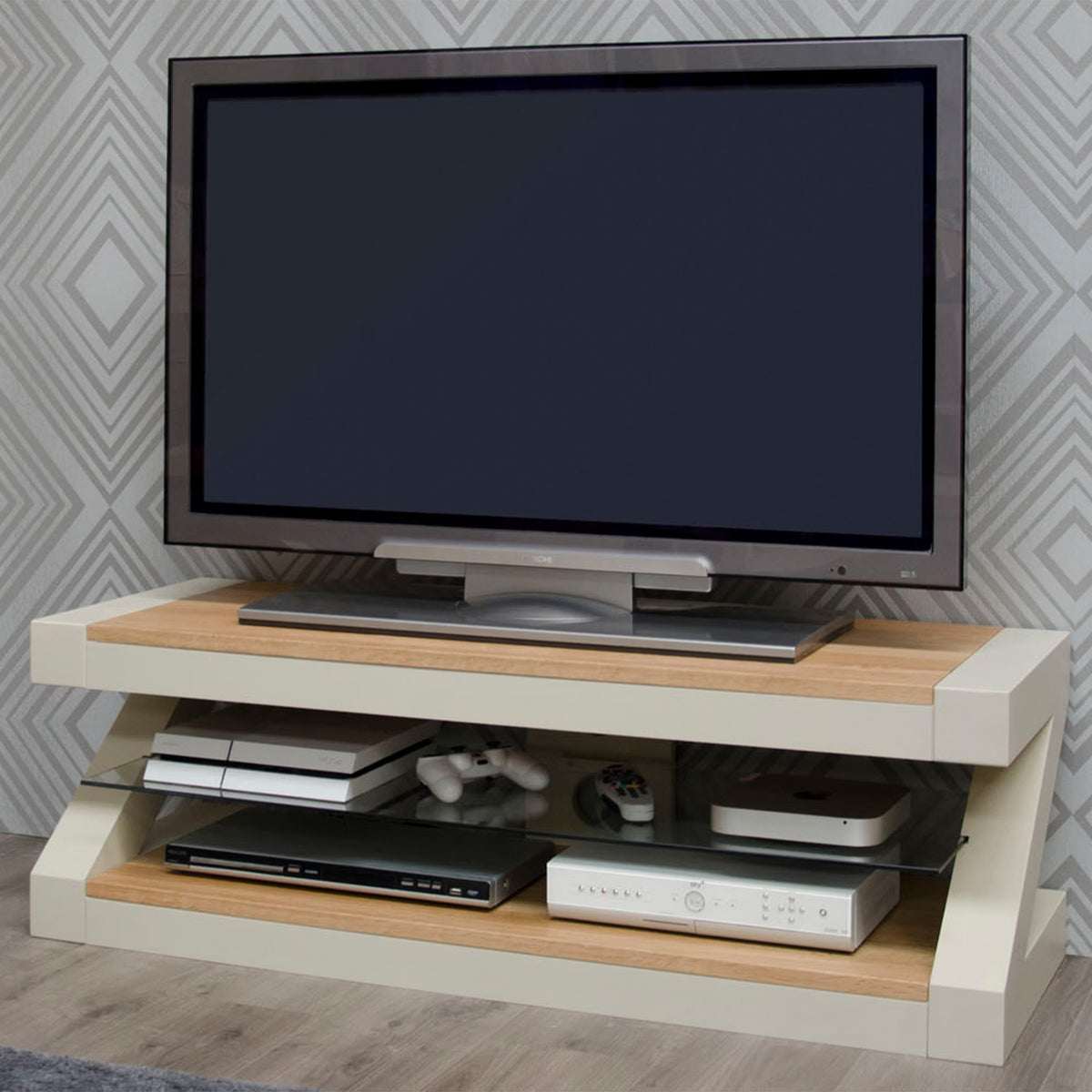 Modern TV stand with wood and cream finish, glass shelf, and entertainment consoles