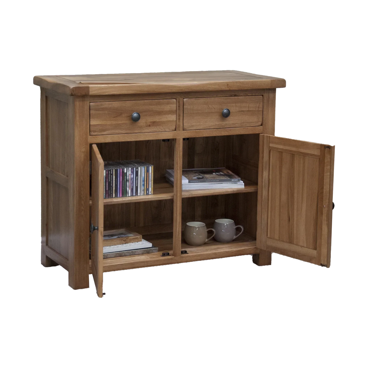 Oak sideboard cabinet with two drawers, open doors, shelves holding mugs, books, and CDs