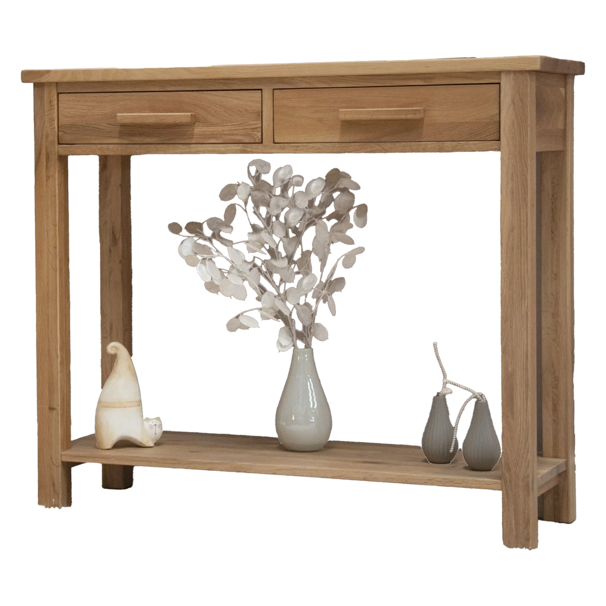 Oak console table with two drawers, lower shelf, decorative vase and ornaments