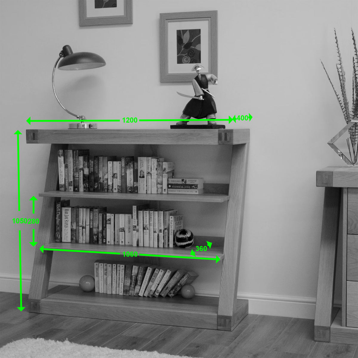 Oak bookcase with three shelves, books and decor, green measurement markers, modern room
