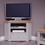 Corner TV unit with oak top, open shelves and drawer, painted light grey finish