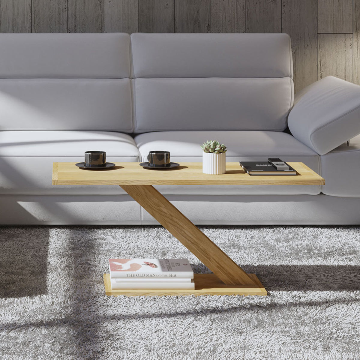 Modern wooden coffee table with angled base in front of grey sofa on plush rug