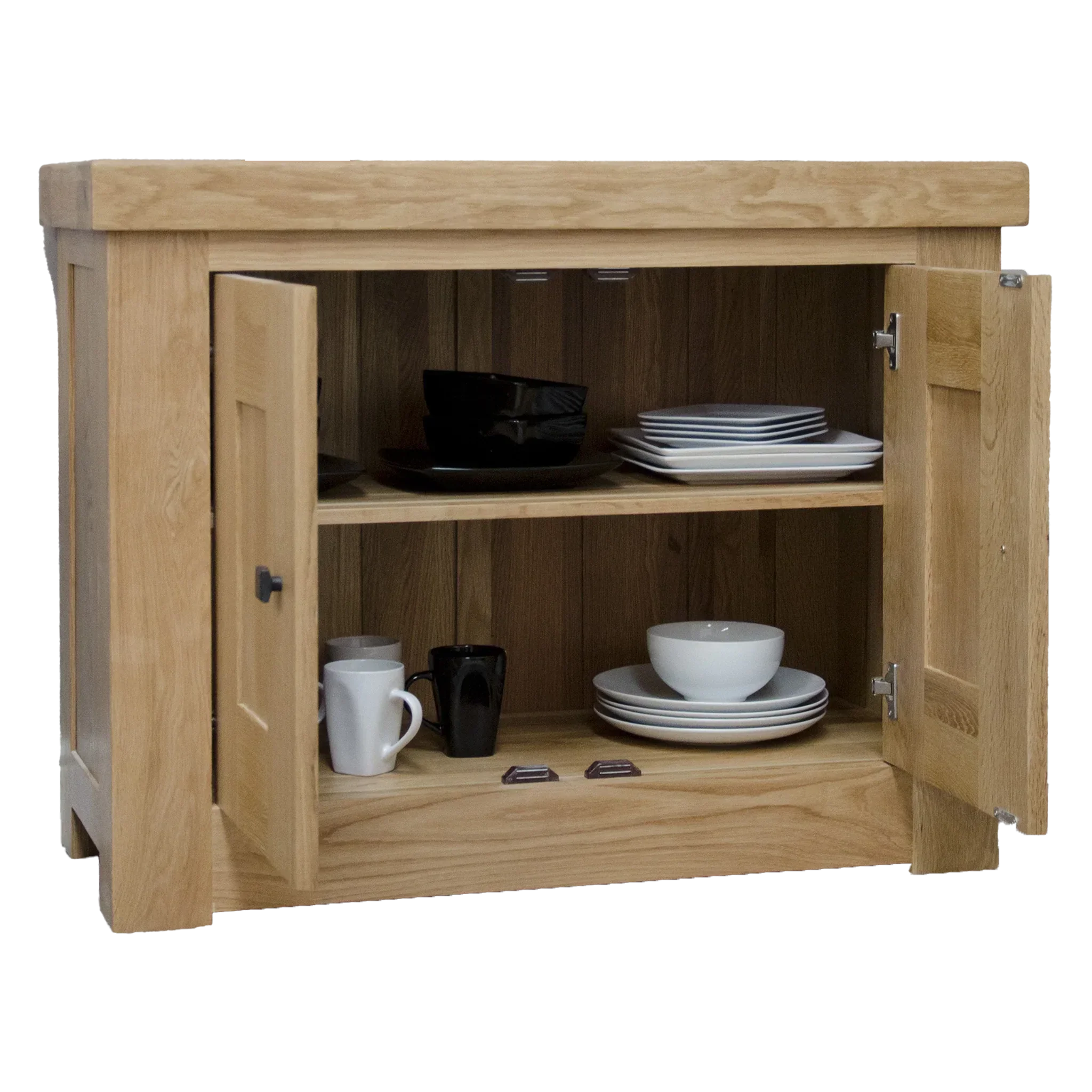 Oak sideboard with double doors open, displaying plates, bowls, and mugs on shelves