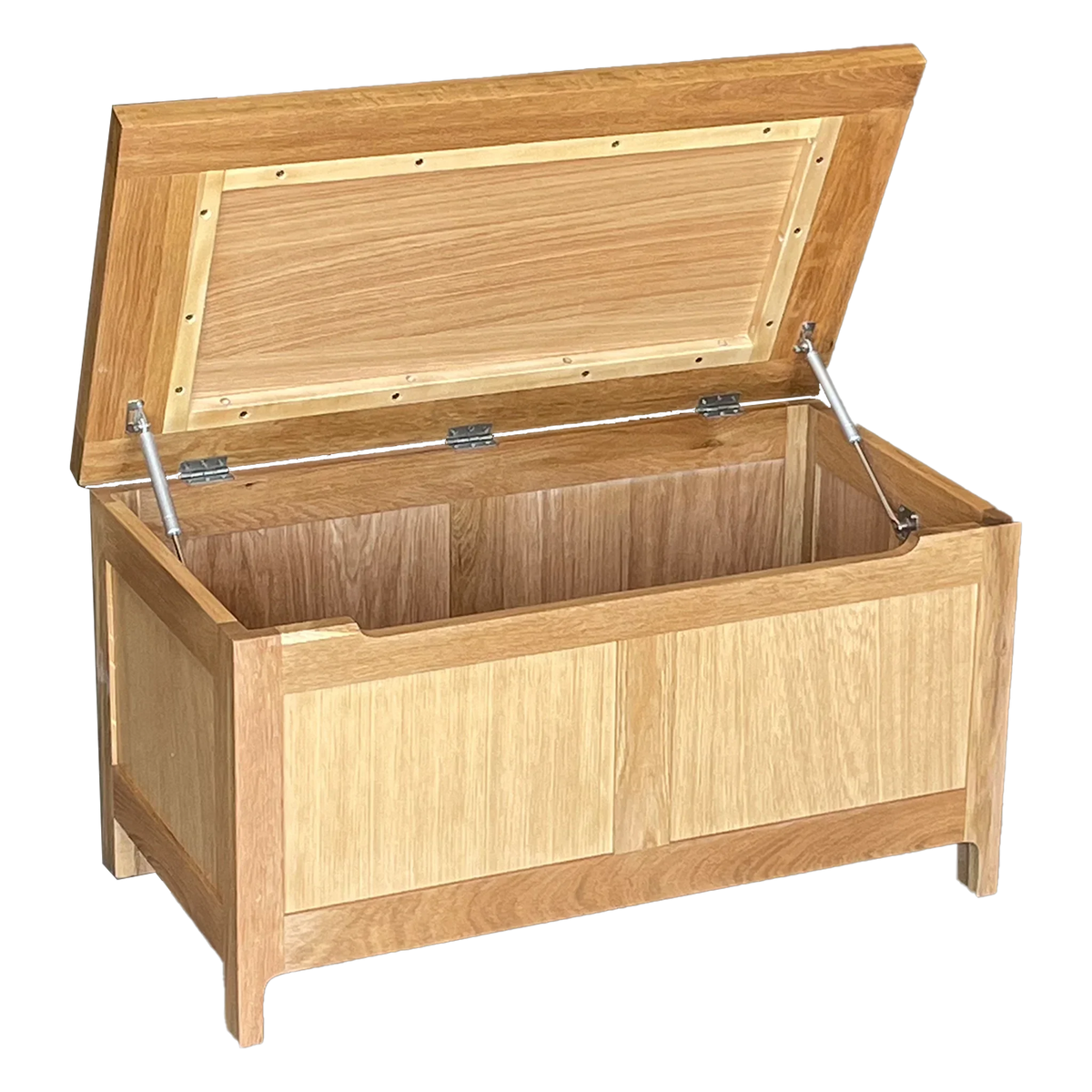 Solid oak blanket box with hinged lid and panel detail, shown open for storage