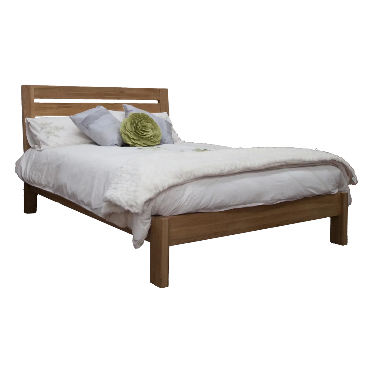 Oak wooden bed frame with white bedding and decorative pillows