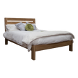 Wooden bed frame with headboard, white bedding, and decorative pillows