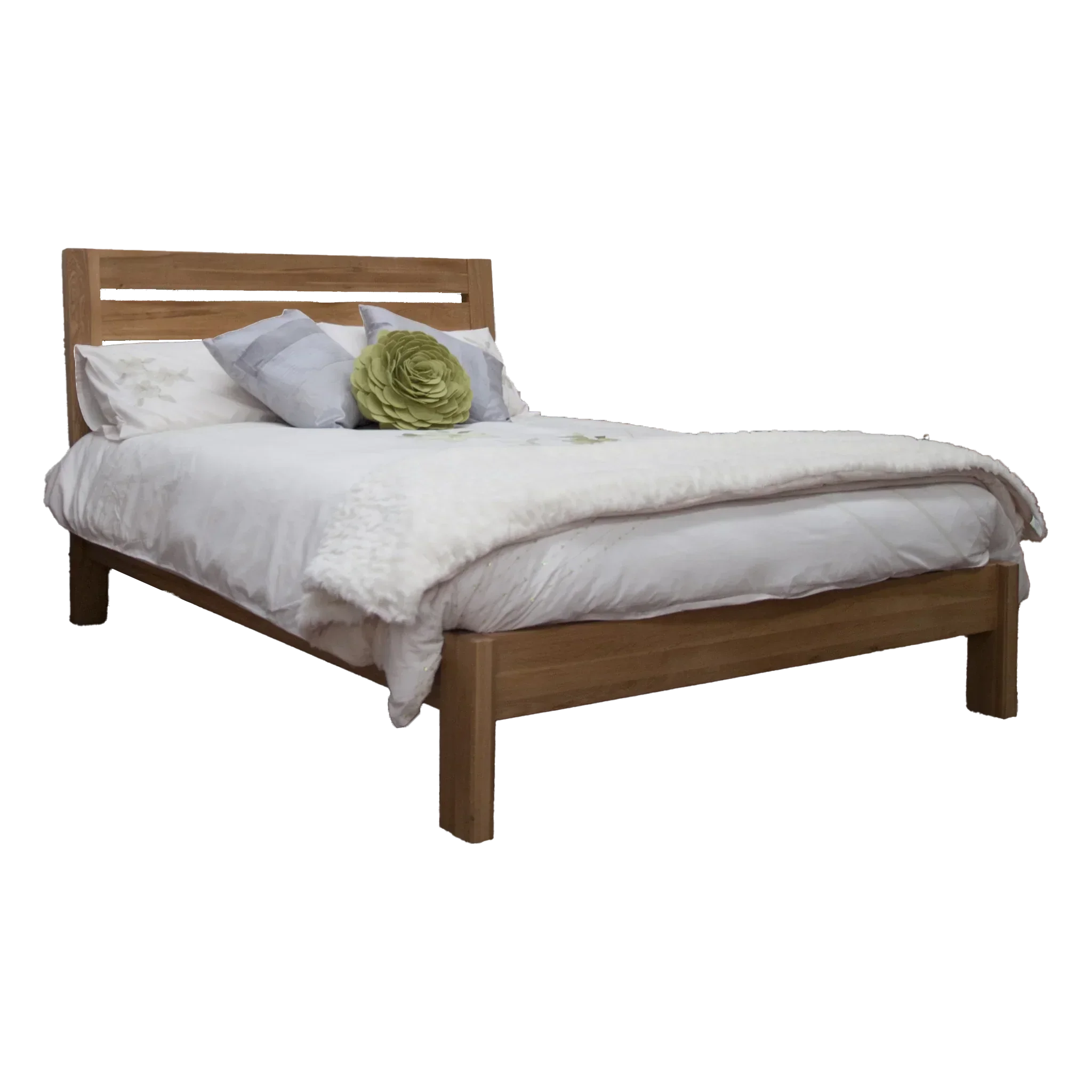 Wooden bed frame with headboard, white bedding, and decorative pillows
