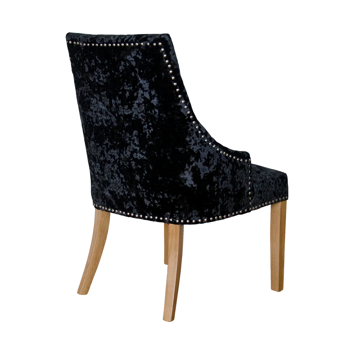 Black velvet dining chair with metal stud trim and light wood legs, rear angle view