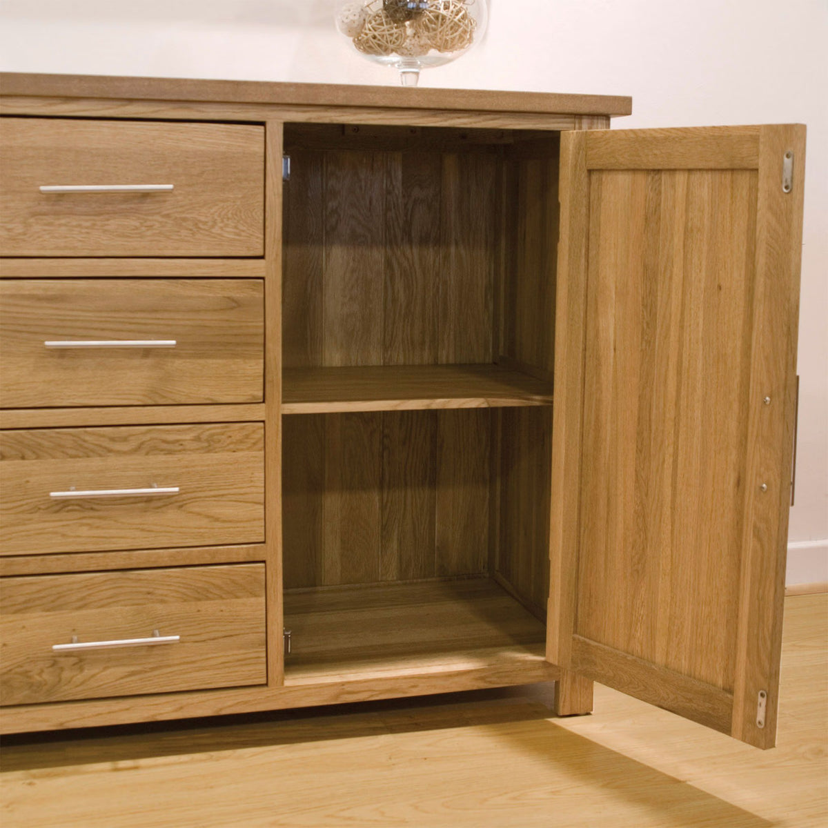 Oak sideboard cabinet with open door, internal shelves and metal drawer handles
