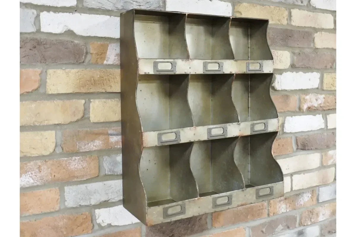 Metal wall storage organizer with nine compartments mounted on exposed brick wall