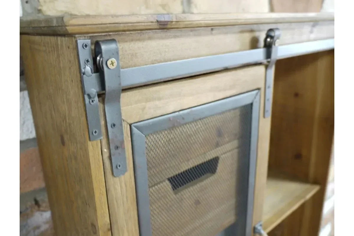 Close-up of wooden cabinet with sliding metal mesh door and metal hardware