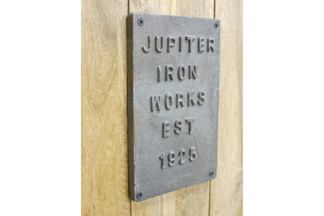 The Jupiter Industrial Wine Cabinet features a rustic wooden design with a vintage metal plaque, adding a touch of industrial charm to any space