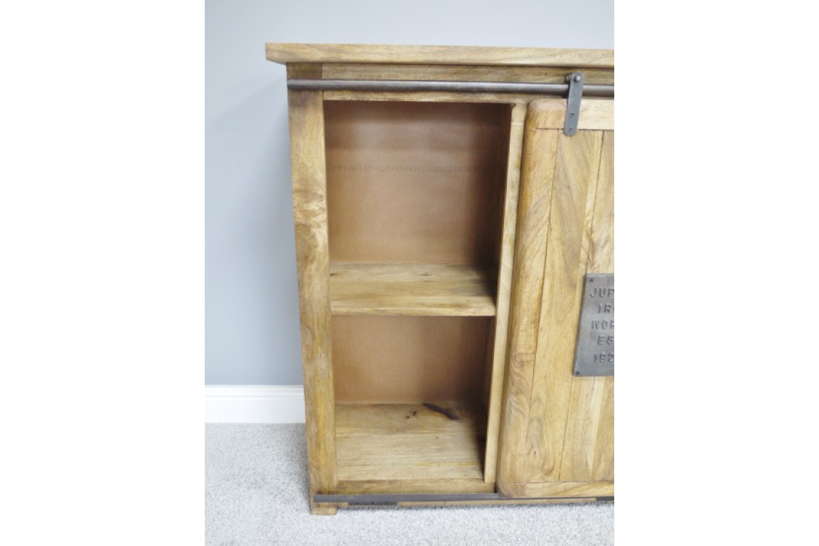 The Jupiter Industrial Wine Cabinet features a rustic wooden design with a sliding door, showcasing two open shelves for storage and a metal accent plate