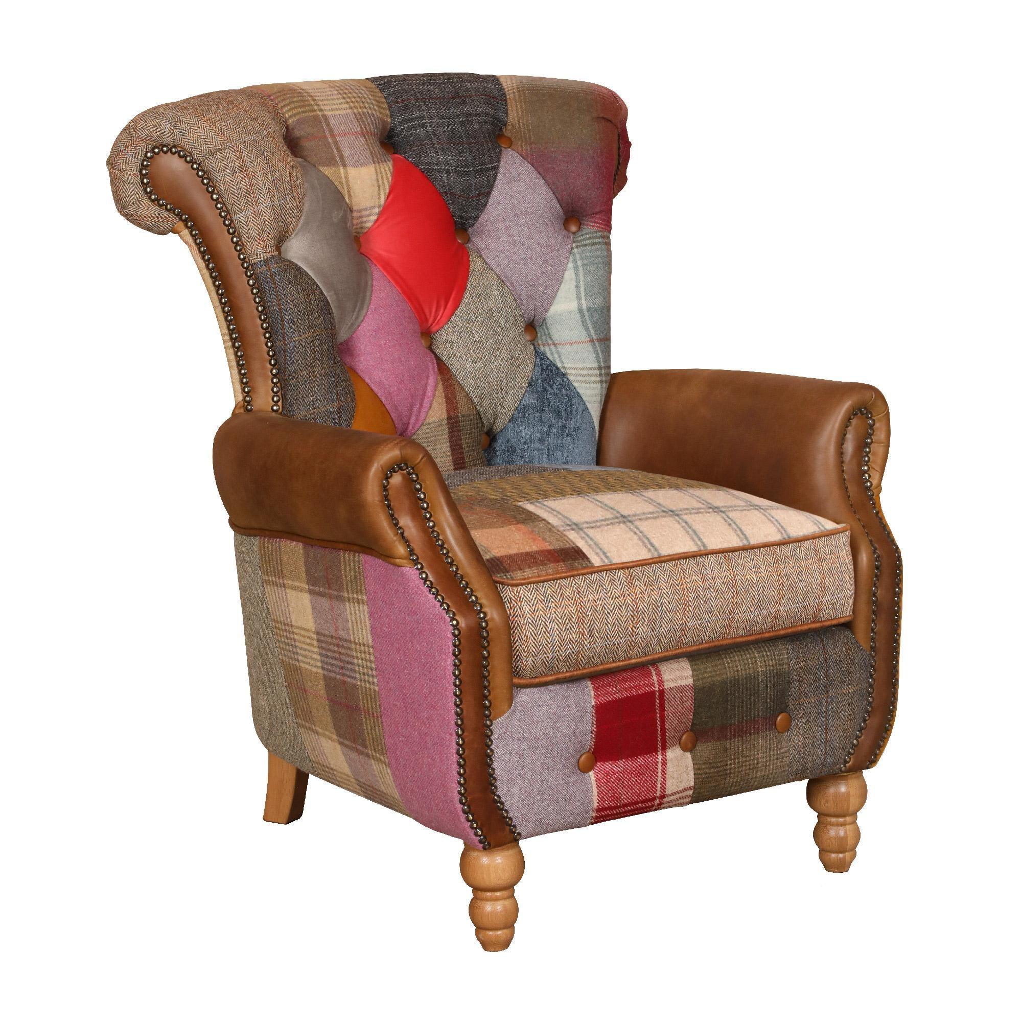 Patchwork armchair with brown leather arms and multicoloured fabric upholstery, angled view