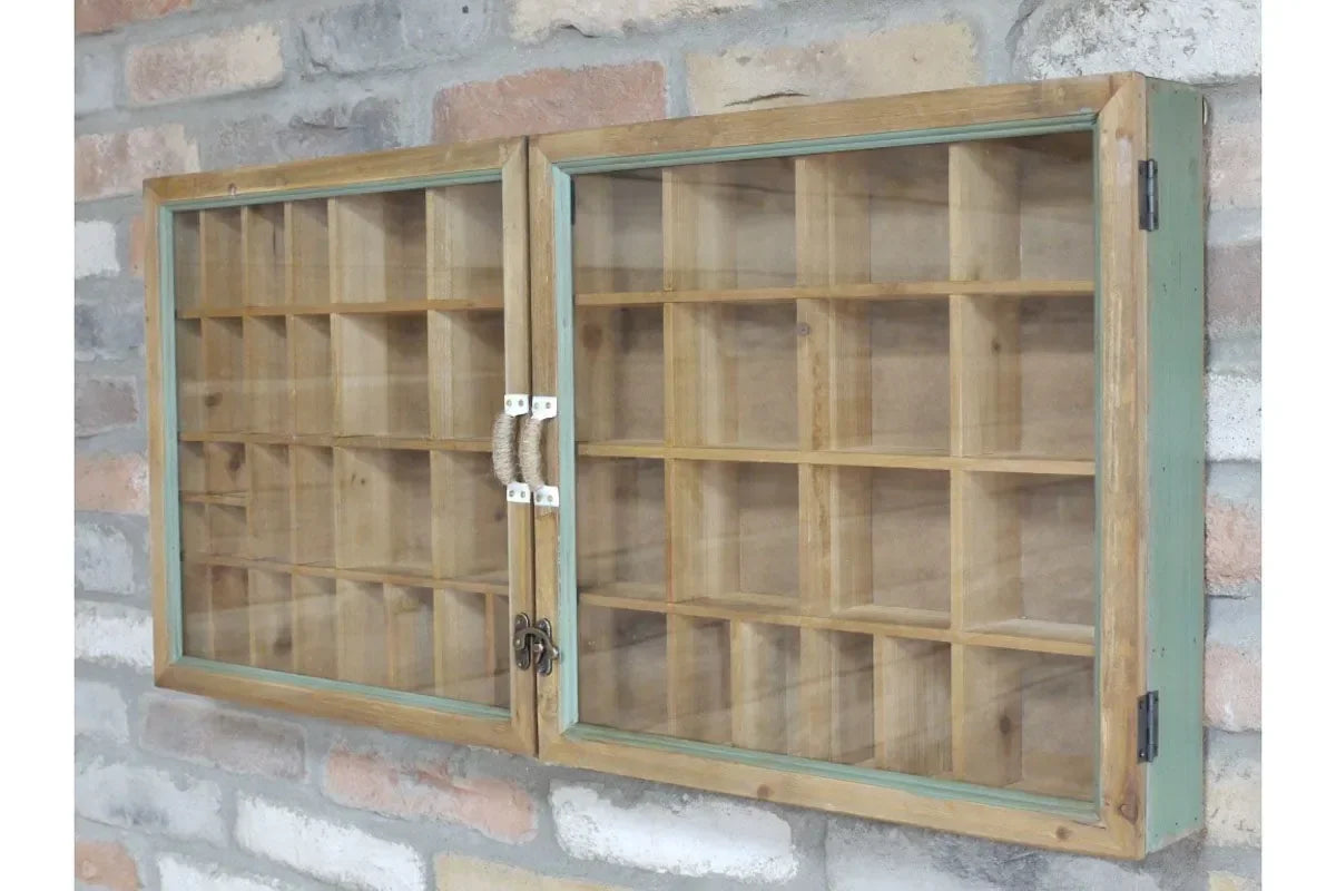 Wooden display cabinet with glass doors and multiple shelves mounted on brick wall