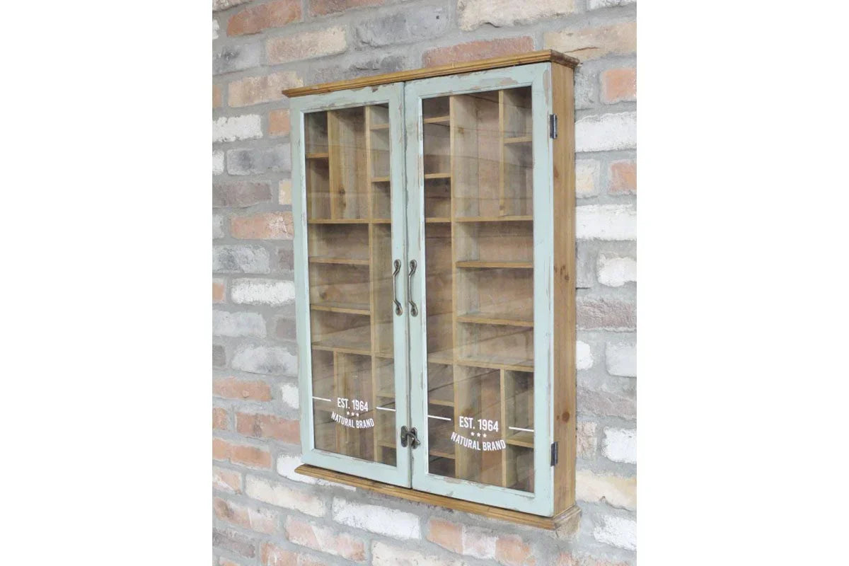 Rustic wooden wall cabinet with glass doors and shelves mounted on brick wall