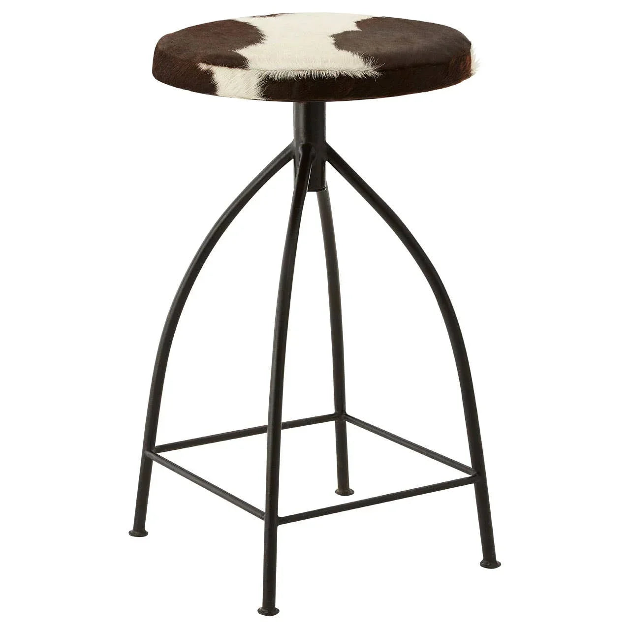 Brown and white cowhide bar stool with round seat and black metal frame, side view