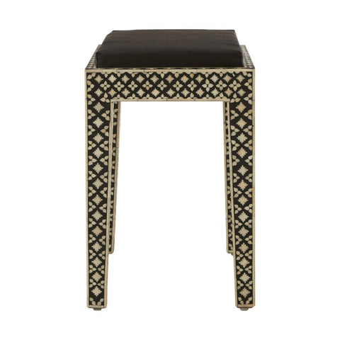 Boho black stool featuring a sleek, square top and intricately designed legs adorned with mother of pearl inlay, showcasing a geometric pattern. The stool has a minimalist aesthetic with a dark finish that highlights the decorative details