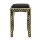 Boho black stool featuring a sleek, square top and intricately designed legs adorned with mother of pearl inlay, showcasing a geometric pattern. The stool has a minimalist aesthetic with a dark finish that highlights the decorative details