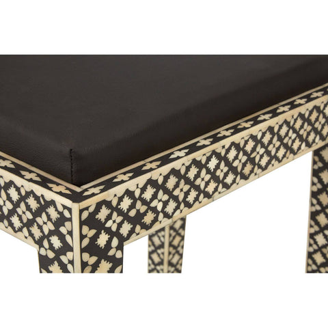 Boho black stool featuring a sleek black cushion and intricate mother of pearl inlay detailing along the edges and legs, showcasing a geometric pattern