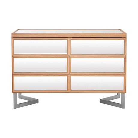 A modern six-drawer chest featuring a sleek design with a light wood finish and white drawer fronts. The chest is supported by stylish silver metal legs, providing a contemporary look suitable for various home decor styles