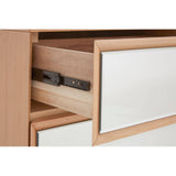 Close-up view of the Kensington Townhouse 6 Drawer Chest, showcasing a partially opened drawer with a smooth wooden interior and a sleek white front panel. The drawer features a metal glide system for easy opening and closing. The chest has a modern design with clean lines and a natural wood finish
