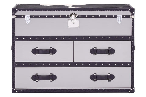 Three-drawer cabinet featuring a black and white hair-on-leather design, with decorative metal accents and handles. The cabinet has a sleek, modern look, suitable for home decor