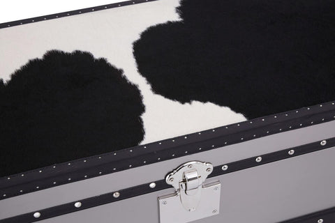 Close-up view of the Kensington Townhouse 3 Drawer Cabinet featuring a black and white hair-on-leather surface. The cabinet showcases a sleek design with three drawers, each adorned with a silver handle. The contrasting textures of the leather create a striking visual appeal, highlighting the unique patterns in the material