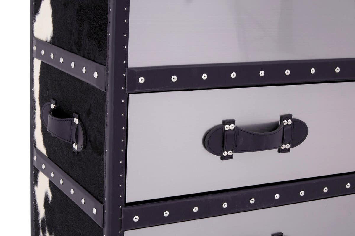 Three-drawer cabinet featuring a black and white hair-on-leather design, with a sleek, modern aesthetic. The cabinet has a glossy finish, accented by decorative nailhead trim and sturdy black handles on each drawer. The overall look is stylish and contemporary, suitable for various home decor styles
