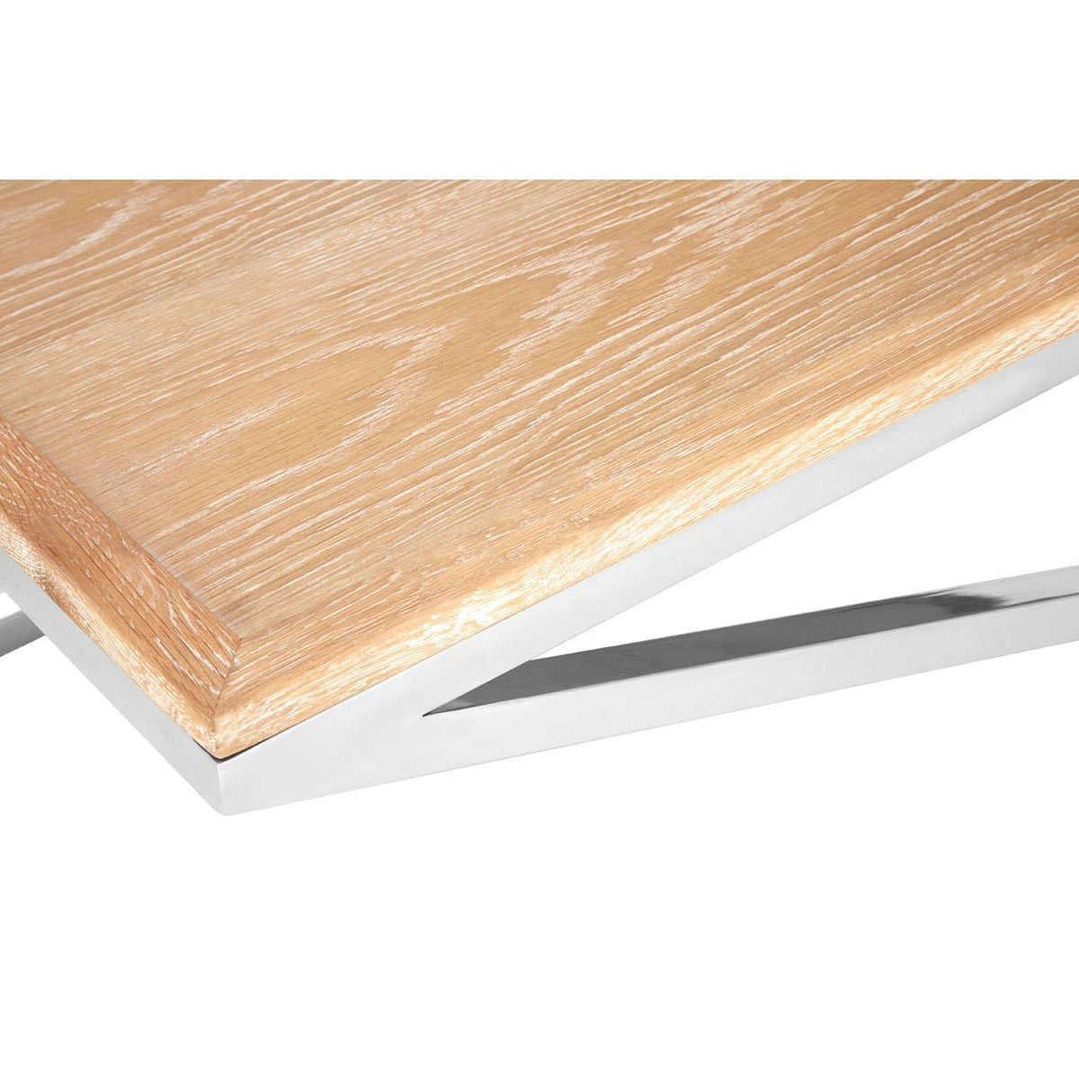 Oak wood table top with chrome metal legs, close-up of contemporary dining table corner