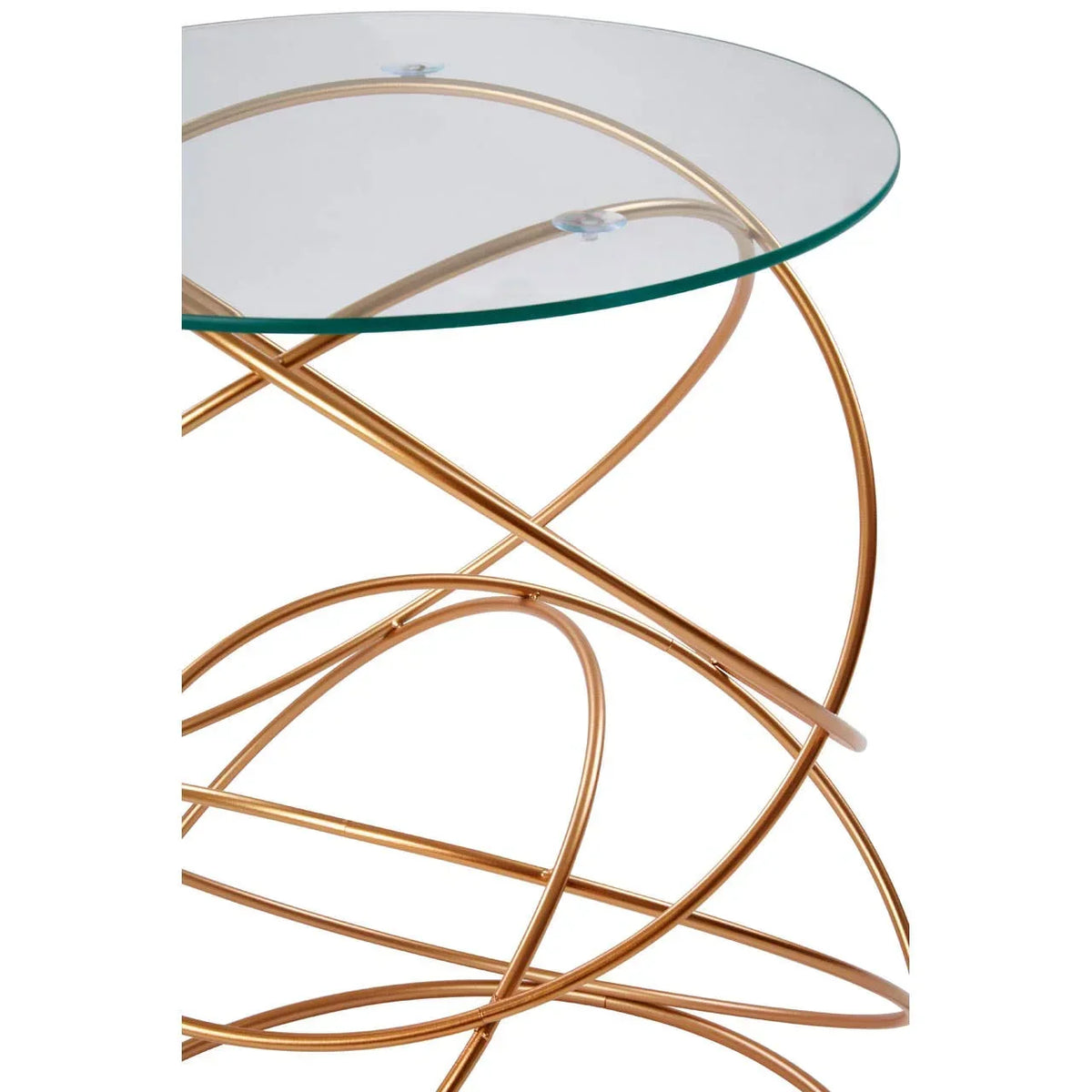 Round glass side table with gold metal swirl base, close-up angle