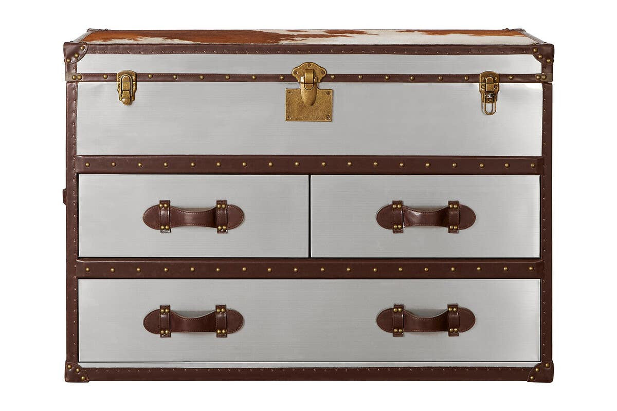 A stylish cabinet featuring a brown and white cowhide design, with a smooth white front and rich brown accents. The cabinet has a top lid with a brass lock and two large drawers below, each adorned with decorative brown handles. The overall design combines elegance with a rustic charm, suitable for various home decor styles